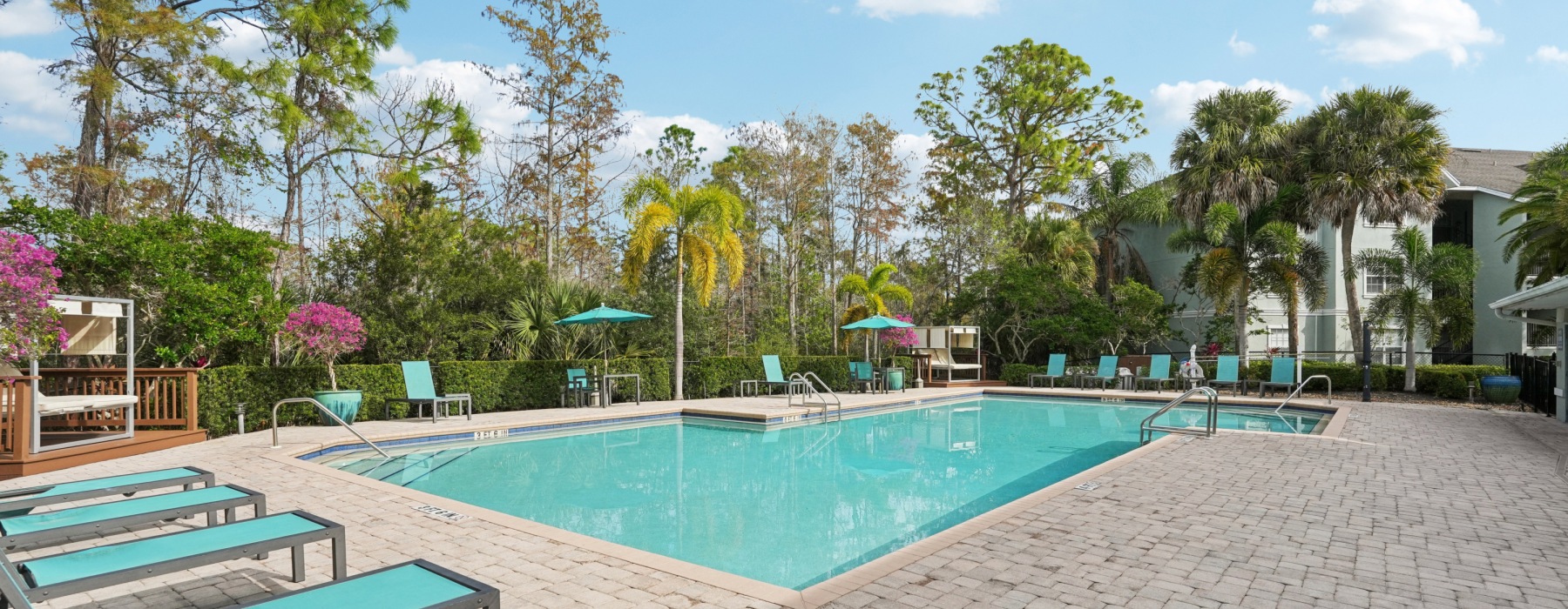 Resort Style Pool with Lounge Chairs, Umbrellas and Cabanas